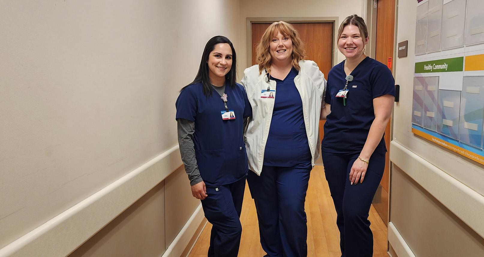 Nurse holding stethoscope and smiling